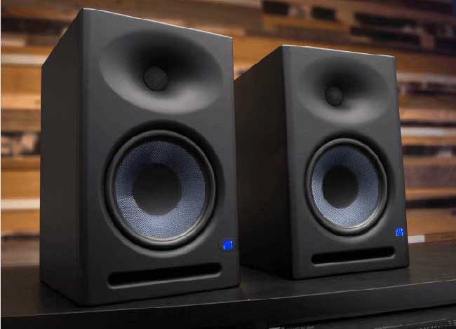 Two Presonus speakers sat on a work surface, similar to the ones used by Neil Williams for listening to audio being recorded for voiceover bookings and clients