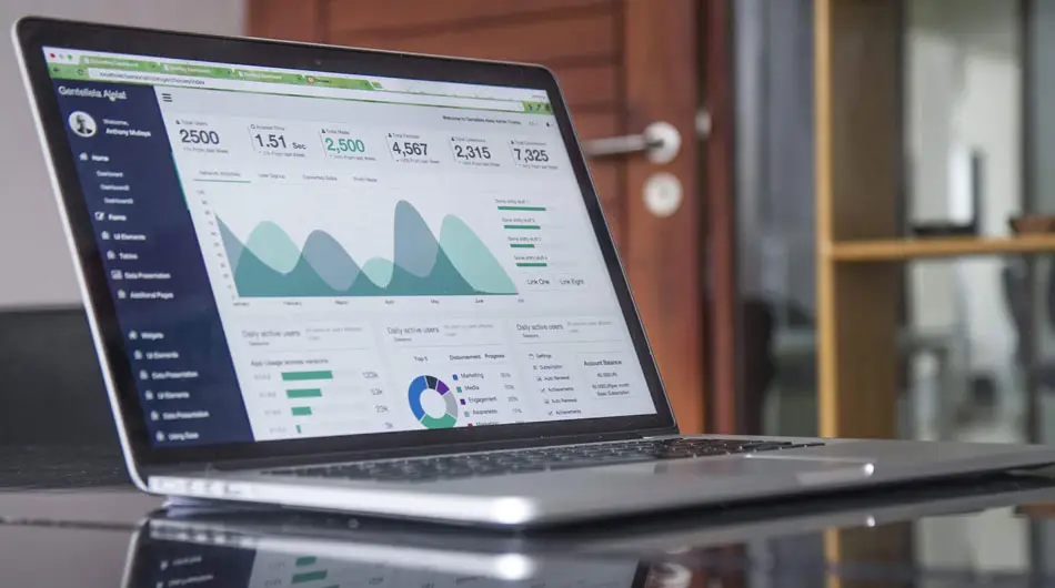 a laptop displaying graphs to show that Neil Williams, Male Voice Over Artist, is available to hire for corporate voice overs