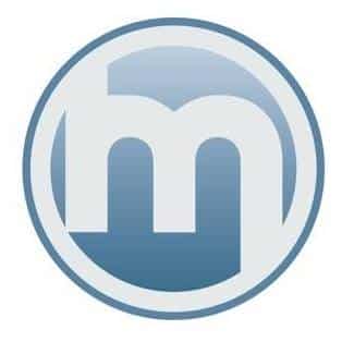 Mad Town Media Logo for voice overs by Neil Williams. The logo is a circle with a blue outline. in the circle there is a white border around the inside section, with a large blue circle in that. In the blue circle is the white outline of the letter M